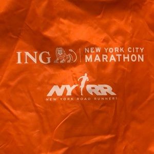 New York City Marathon poncho from 2013 race orange. O/S orange/inside blue